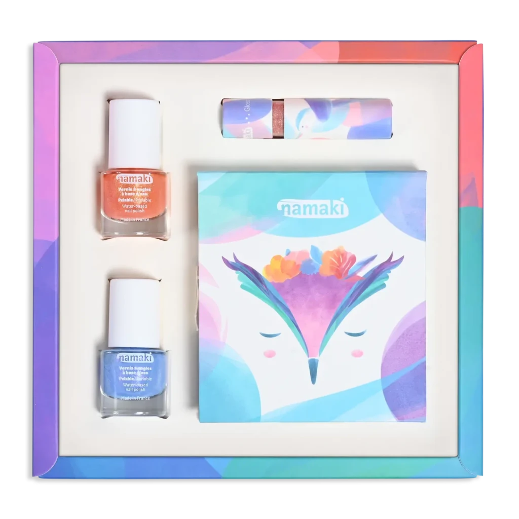 Namaki | Children's Organic Make Up Set in Fairy Moonlight 1 eyeshadow palette with 7 luminous pearly colours with mirror and applicator
1 glitter pink gloss with a peach fragrance
1 Coral water based peel off nail polish
1 Blue Lavender water based peel off nail polish