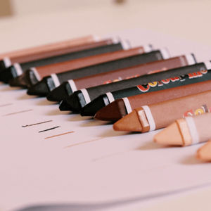 A Selection of Skin Tone Crayons Ranging From Light Nude Pink To Dark Brown